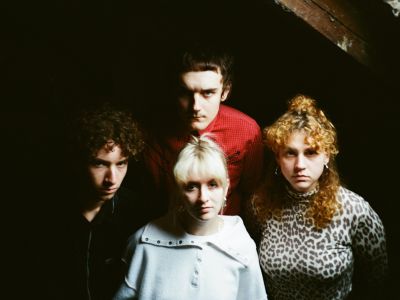 Laundromat Chicks band pic in dark attic